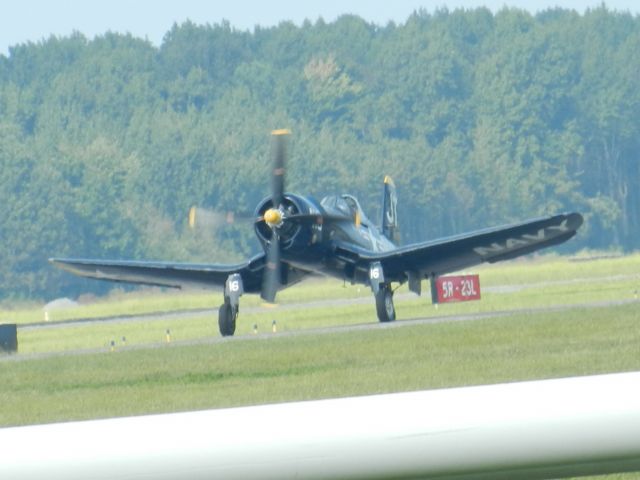 — — - Jim Tobol's F-4U Corsair Taxies While An F-18 Is Taxiing Behind The Corsair