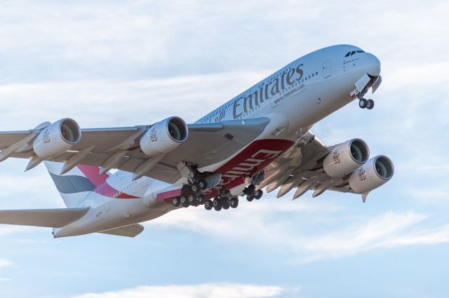 Airbus A380-800 (A6-EUL) - The new whale getting airborne off Runway 02 bound for Sydney into the setting sun, which is just to the right of the photo. A full frame image taken on my 300mm/f2.8 lens.