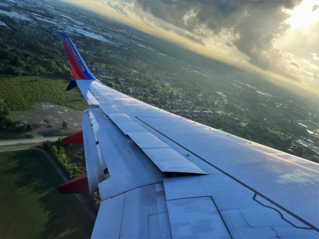 Boeing 737-800 (N8610A) - Climbing out of Houston on a hazy morning