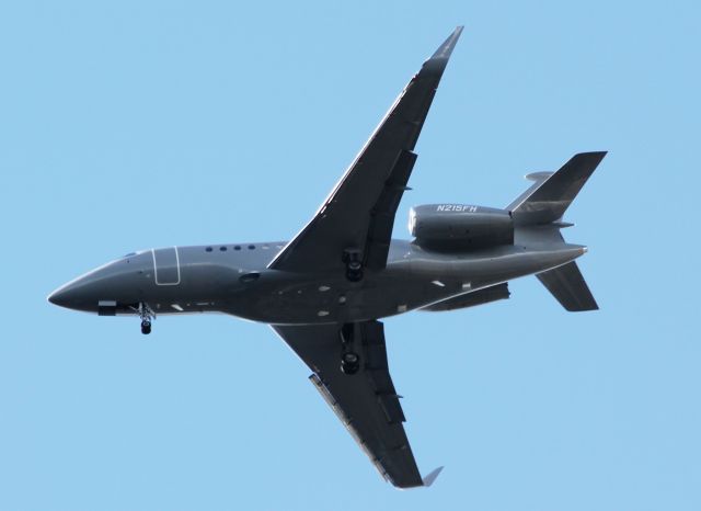 Dassault Falcon 2000 (N215FH) - Wheels down, making final approach to Orlando International. MCObr /Clear skies, runway in sight.