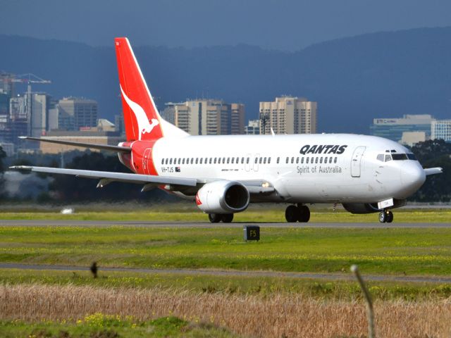 BOEING 737-400 (VH-TJS) - On taxi-way heading for take off on runway 05. Thursday 12th July 2012.