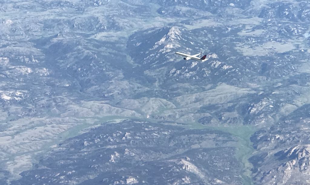 Boeing 737-900 — - SOMEWHERE OVER THE AMERICAN WEST, USA-JUNE 20, 2021: Seen from a starboard side window, approximately four hours into a five hour flight from Newark, New Jersey to Salt Lake City, Utah, was this twin engine commercial passenger jet. Altitude was approximately 35,000 feet.