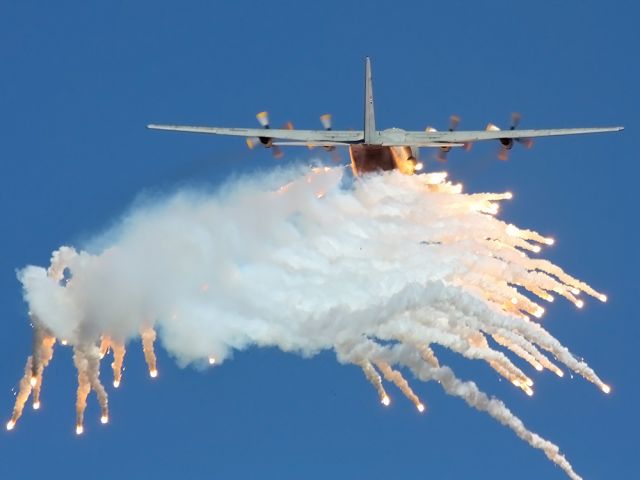 Lockheed C-130 Hercules (N405) - South African Air Force C-130BZ deploying flares