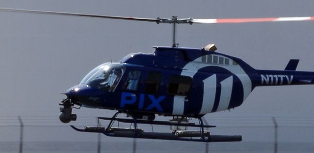 Bell JetRanger (N11TV) - LINDEN AIRPORT-LINDEN, NEW JERSEY, USA-AUGUST 21, 2020: A news helicopter from one of the local New York City T.V. stations is pictured taking off.