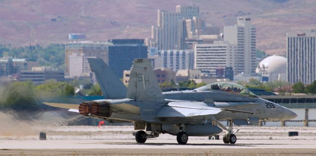 McDonnell Douglas FA-18 Hornet (16-4203) - This departure shot of 164203, the VMFAT-101 "Sharpshooters" Hornet in which USMC Maj Christopher is the instructor pilot occupying the "back seat," catches the F/A-18D with burners lit as it begins its takeoff roll down runway 34R as part of a Flight Of Three headed for Phoenix.  In the pic I posted just before this one, they had arrived using the call sign "Shooter One Two" because there had only been two Bugs travelling together, but while they were here a third "Sharpshooters" Hornet landed from Missoula and when the three of them all departed, the call sign used by instructor Christopher was "Shooter One Tree."  