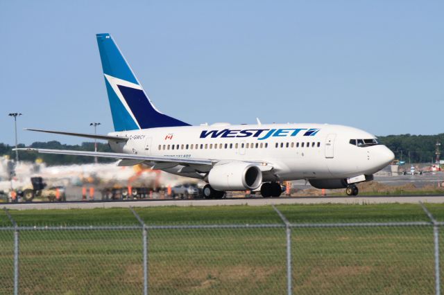 BOEING 737-600 (C-GWCY) - Departing Montreal-Trudeau for Edmonton