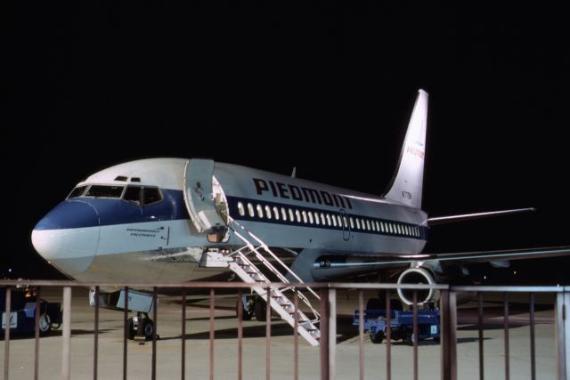 Boeing 737-700 (N779N) - Another night shot of Piedmont Airlines 737, named "Rappahannock Pacemaker".   From a 35mm slide shot in early 1980's.