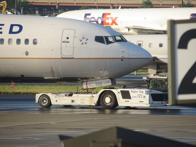 — — - Airport scene at Newark. Photo is meant to be artsy. Note the FedEx 727F in the background.