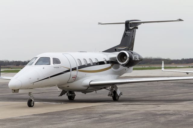 Embraer Phenom 300 (N12ML) - A Phenom 300 prepares to taxi away from Corporate Wings at KSBN.