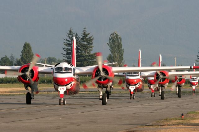 — — - Trackers taxiing back to their platform at Abbotsford after a firefighting mission