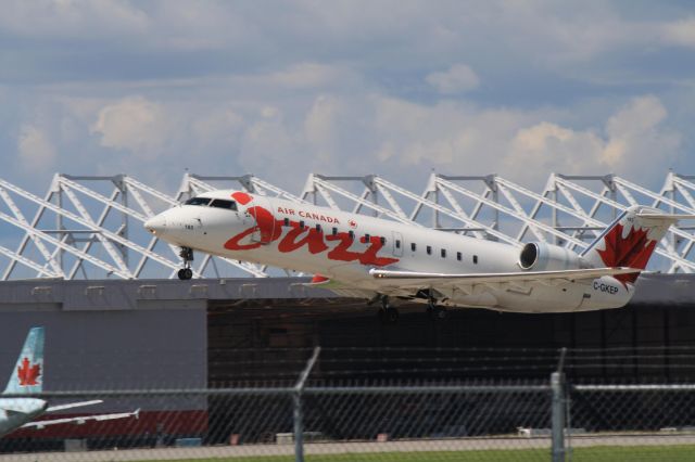 Canadair Regional Jet CRJ-200 (C-GKEP) - Leaving Montreal in mid afternoon