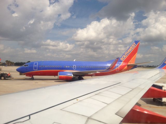 Boeing 737-700 — - Pushback from the gate