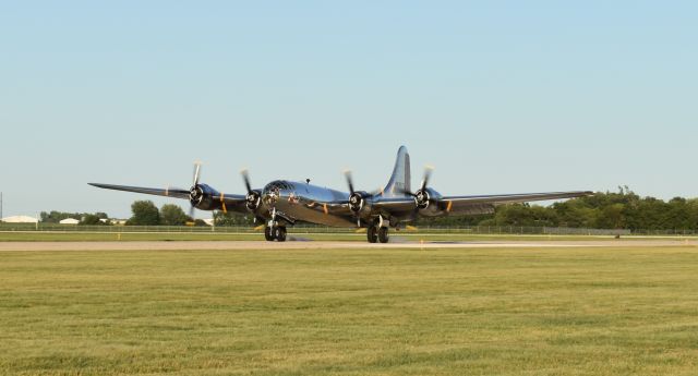 Boeing B-29 Superfortress (N69972) - Right at the moment of touchdown as Doc returns from a sunset flight at Mason City Municipal Airport.