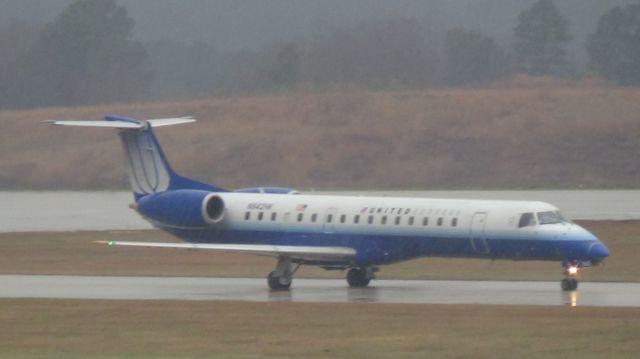 Embraer ERJ-145 (N842HK) - "Blue Tulip" or "Shades of Blue" lives RDU for the last time.  Taken March 19, 2015.