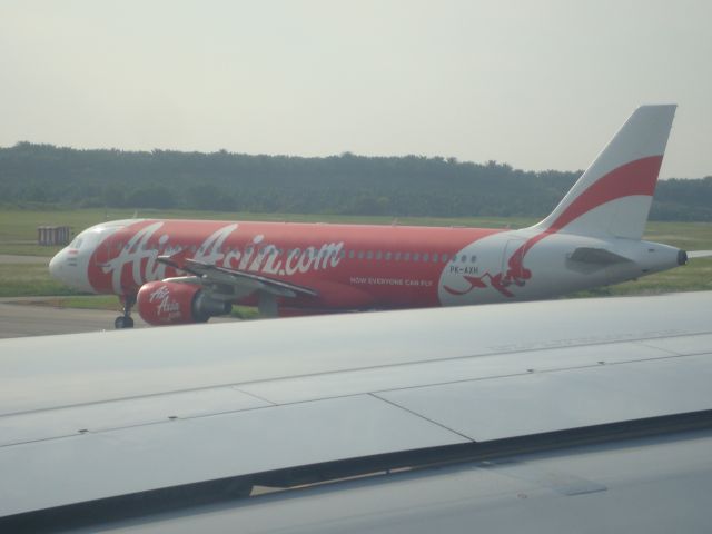 Airbus A320 (PK-AXH) - Taken on-board 9M-MTK.