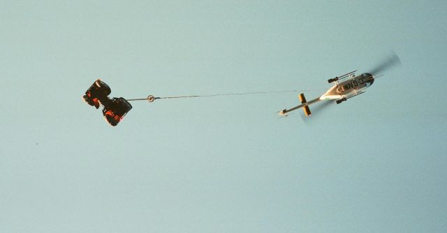 Bell JetRanger — - Helicopter dropping A.T.V. Norhern Alberta Canada. Taken 2003.