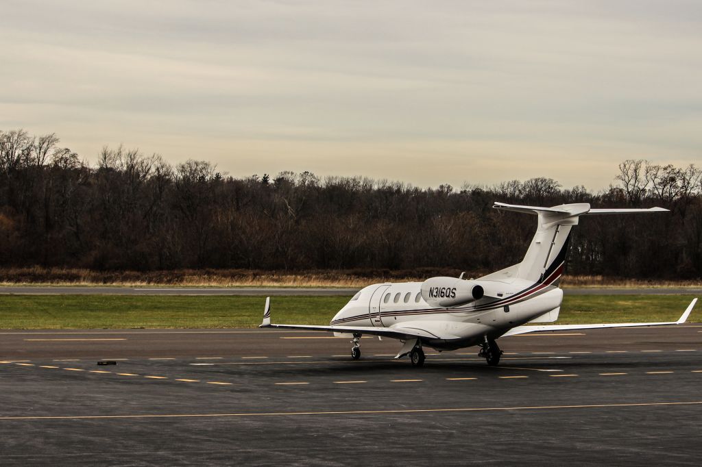 Embraer Phenom 300 (N316QS) - Parked On Ramp