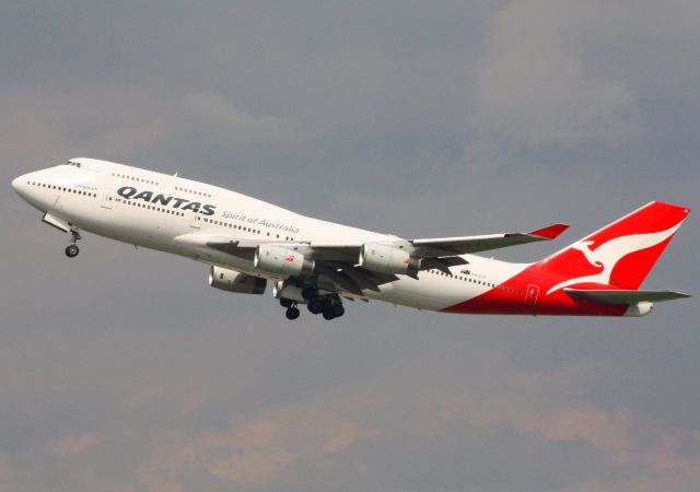 Boeing 747-400 (VH-OJS) - A very, very rare appearance in Manchester. This aircraft came in from Sydney early in the morning on Monday 16/07/12 with a large (400+) Australian religious group on board. A few days later, the religious group made their way by road down to Cardiff, Wales. I got this photo on Saturday 21/07/12 of the aircraft taking off empty down to Cardiff to pick them up and take them to Lyon, France. This photo was taken from the viewing mound at the southside location next to runway 23L. It had been cloudy all morning in Manchester but just as the aircraft was half way down runway 23R on its takeoff roll, the good lord our god answered all our prayers and the sun came out for literally 30 seconds, just long enough for me to get this beautiful photo. The second after I pressed the shutter button, the sun then disappeared again for another two hours! My prayers were answered!