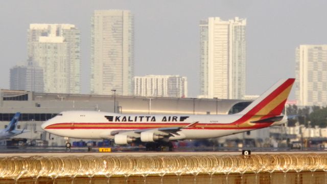 Boeing 747-400 (N706CK) - With The City of Miami Skyline,and the glistening of concertina wire"In the sun!"