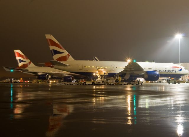 Boeing 777-200 (G-VIID) - 2 tail night reflection after snow, rain and ground fog @ KBOS Logan on FlightAware.Com !