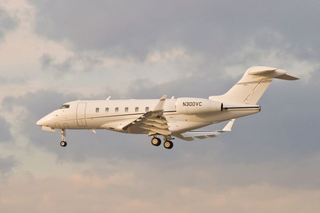 Bombardier Challenger 300 (N300VC) - Winter sunset arrival on RWY27 @ KBOS Logan Airport -Very 1st upload ever of N300VC on FlightAware.Com !