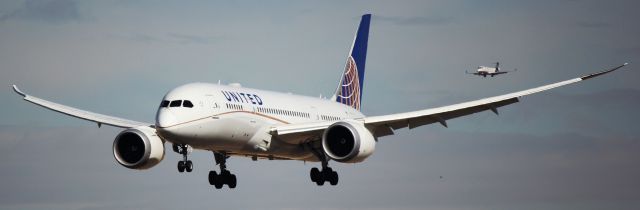 Boeing 787-8 (N27903) - Landing on 16L. United CRJ200 behind it is landing on 16R.