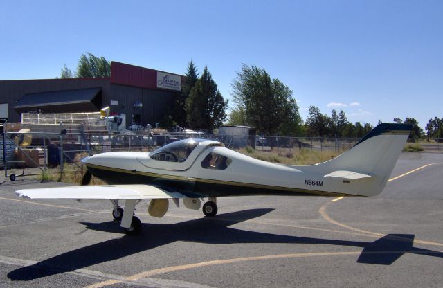 Lancair Legacy 2000 (N460JP) - Photo shows 2003 LANCAIR LEGACY, serial number L2K-204 shown as the entry gate to Lancair facility in 2006. N-number was changed to N460JP and this number (N564M) now belongs to another plane. L2K-204 still has green paint and yellow gear doors but n-number relocated.