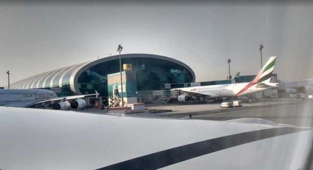 Airbus A380-800 (A6-EEE) - Taxiing to the runway past two other Airbus A380s and a Boeing 777