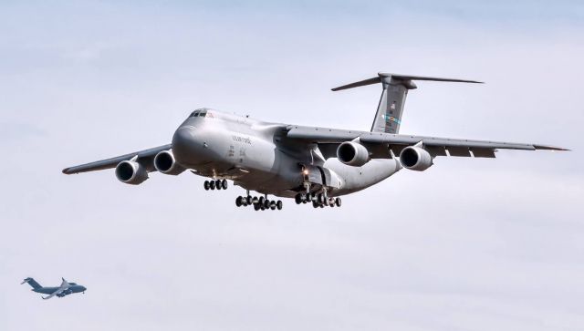 LOCKHEED C-5 Super Galaxy (N87035) - Transition work in Dover, Delaware.  The C5 squadron there (9th Airlift Squadron) was celebrating its 75th anniversary.  The C-17 in the background made for some interesting shots--especially when he flew high formation during one of the approaches. I do miss flying this airplane.