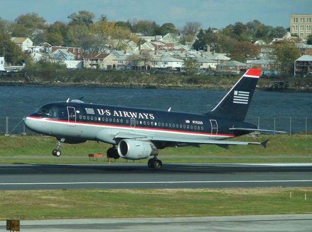 Airbus A319 (N762US) - USAirways A-319 N762US just moments from touchdown on Runway 31 at a very windy KLGA back on October 29, 2006 !