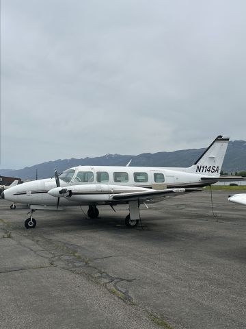 Piper Navajo (N114SA) - Standing on the west ramp. Observed this plane sitting, has been sitting for many years. 
