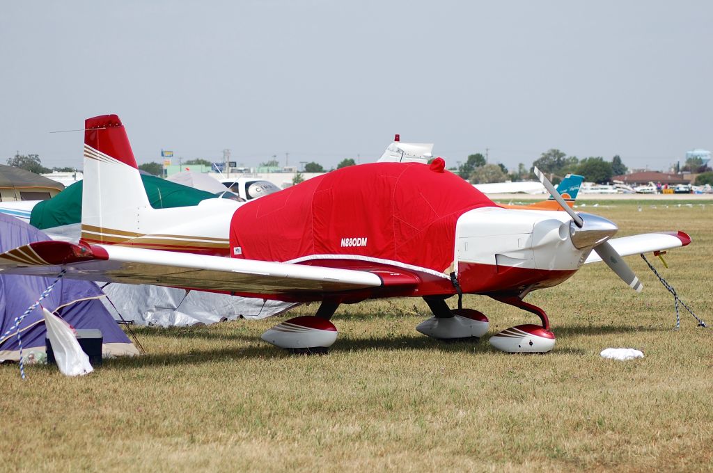 Beechcraft Baron (58) (N880DM) - Parked at the North 40 at Oshkosh on 25 July 2012.