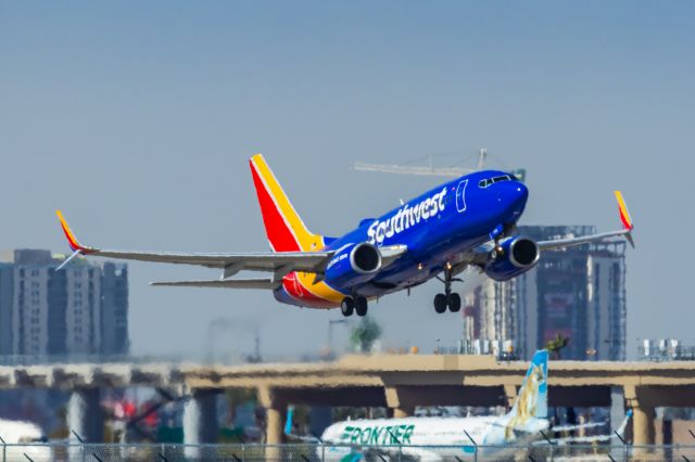 Boeing 737-700 (N7734H) - An Southwest Airlines 737-700 taking off from PHX on 2/11/23 during the Super Bowl rush. Taken with a Canon R7 and Canon EF 100-400 II L lens.