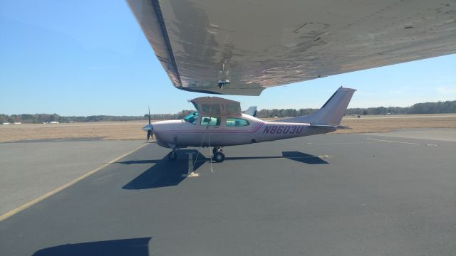 Cessna Centurion (N8603U) - Parked next to a very pink T210. 