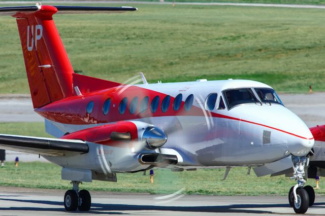 Beechcraft Super King Air 350 (N874UP) - N874UP is a 2017 Beechcraft Super King Air 350. The aircraft had just landed at Atlanta's PDK executive airport from Fayetteville regional airport KFAY and was taxiing to the ramp when I got this photo. The aircraft was formerly owned by UPS, so one has to wonder if it was used for hauling packages and has a ton of hours on it, or if it was used to fly UPS executives around. I shot this with a Canon 5DSR and a Canon 500mm F4 IS lens with a 1.4x extender on it, making the focal length 700mm. Camera settings were 1/250 shutter, F14, ISO 200. Please check out my other aviation photography. Votes and positive comments are always appreciated. Questions about this photo can be sent to Info@FlewShots.com