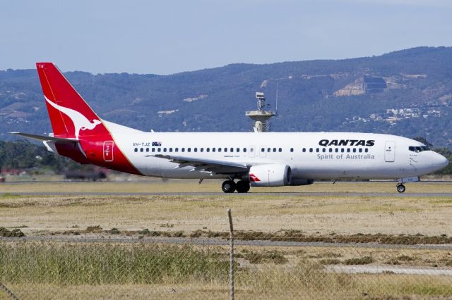 BOEING 737-400 (VH-TJZ) - A Qantas old girl on the taxi-way, heading for take off on runway 05. Friday, 19th April 2013.