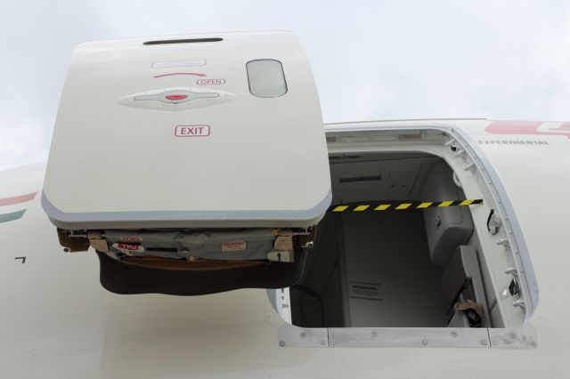 Boeing 787-8 (N1008S) - Not often you get to see the Door and Escape Slide of a B787-800 from this angle, what with the air stairs normally parked in position, blocking the view.
