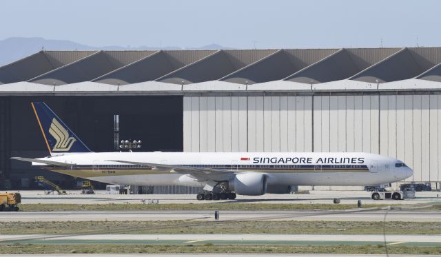 BOEING 777-300ER (9V-SWM) - Getting towed to gate at LAX