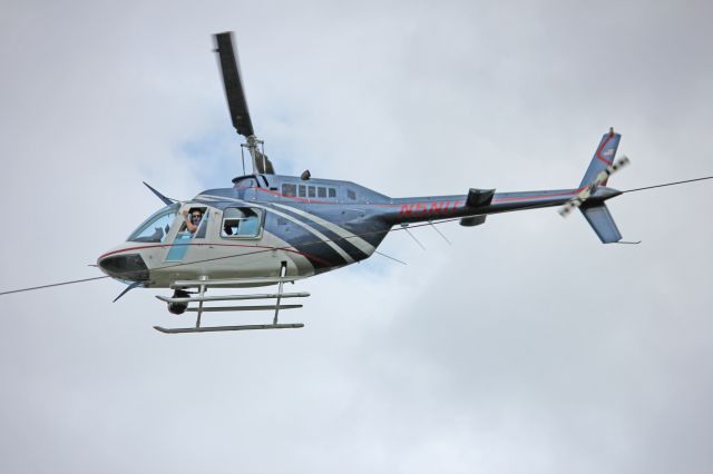 Bell JetRanger (N5NU) - Checking the lines, in my back yard. They went by super slow and were all very friendly. It's a different helicopter everytime.