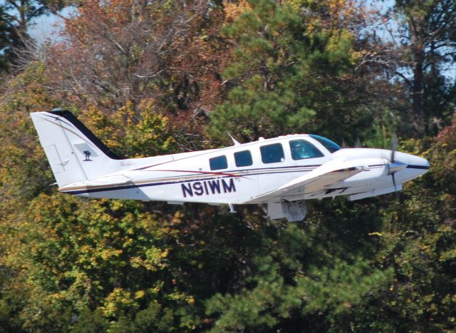 Beechcraft Baron (58) (N91WM) - CLD AIRCRAFT CORPORATION / Departing runway 3 - 11/27/10