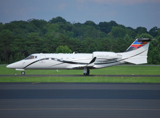 Learjet 60 (N42JP) - WELLS FARGO BANK NORTHWEST NA TRUSTEE (NASCAR driver Juan Pablo Montoya) returning from the Brickyard 400 at KJQF - 7/28/13