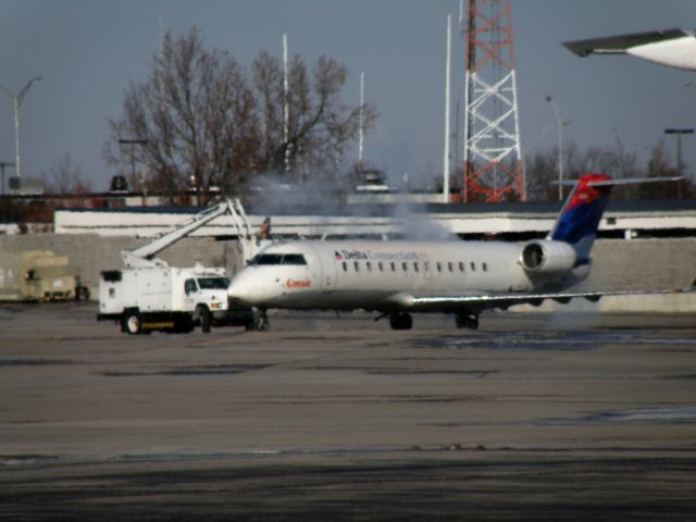 Canadair Regional Jet CRJ-200 (N837AS) - ASQ4964 (N837AS) deicing at Bluegrass Airport prior to departure for Atlanta (KATL)