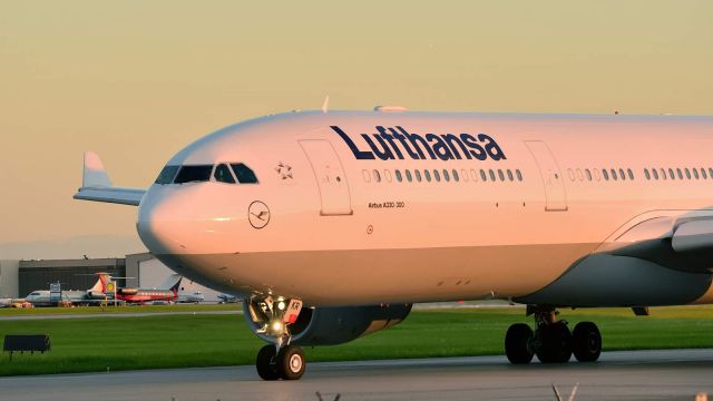 Airbus A330-300 (D-AIKR) - Taxiing to Rwy 24L at sunset.