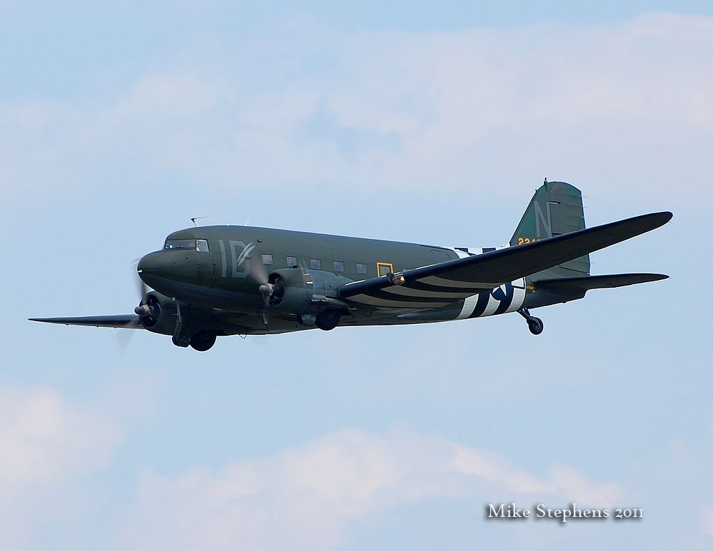 Douglas DC-3 (N74589) - Repainted in its original WW2 D-Day C-47 scheme, returns to KOXC from Oshkosh on 08022011.