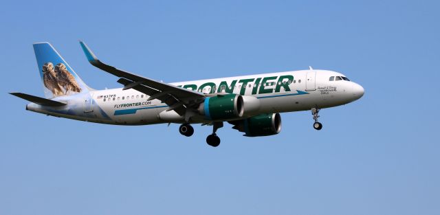 Airbus A320neo (N371FR) - On short final is this 2020 Frontier Airlines Airbus 320-251N in the Summer of 2022.  Getting the tail view is "Parish & Daisy" the burrowing owls.