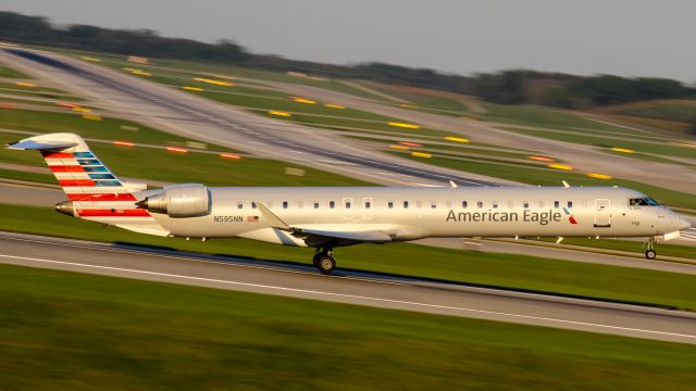 Canadair Regional Jet CRJ-900 (N595NN) - A PSA CRJ-900 wearing American colors blasts out of CVG in the early morning.