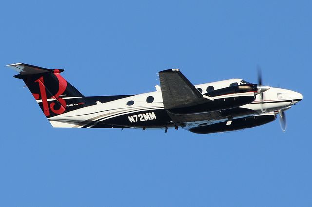 Beechcraft Super King Air 200 (N72MM) - Takes off. 