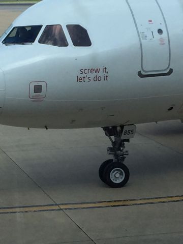 Airbus A320 (N855VA) - Snapped out the window of the departure area, KDCA.  Best "nose art" message in the business.