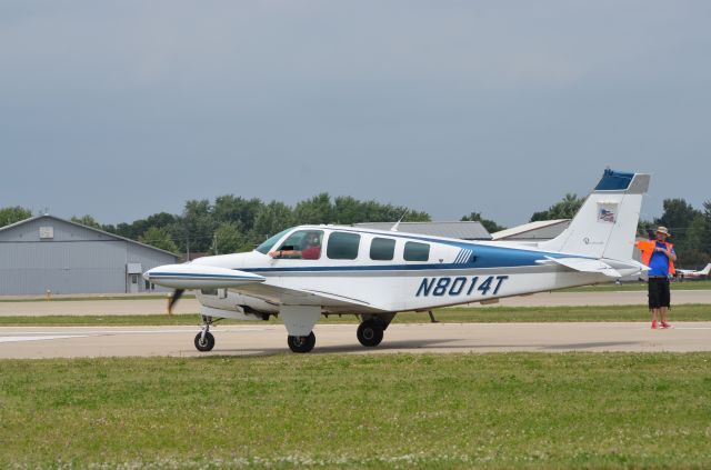 Beechcraft Bonanza (36) (N8014T) - Bonanza mass arrival at AirVenture 2014