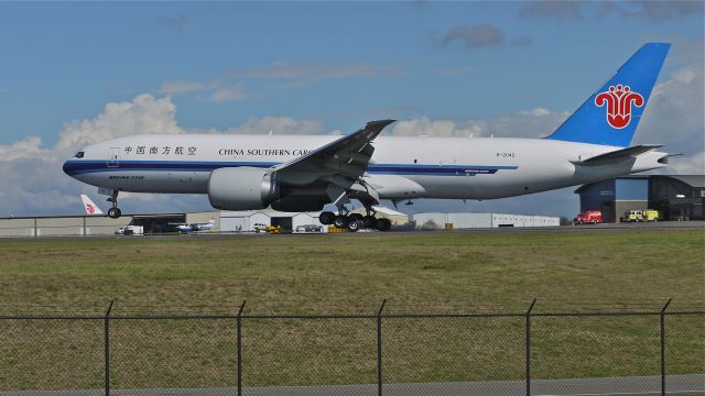 Boeing 777-200 (B-2042) - BOE23 touches down on Rwy 34L to complete a flight test on 9.7.13. (LN:1126 cn 41633).